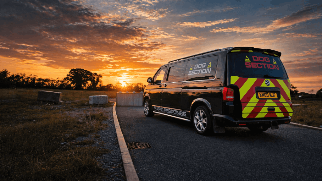 Security dog handler and trained dog preparing for a planned site deployment